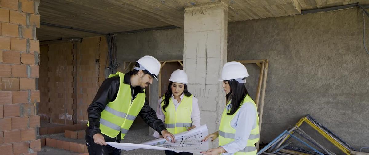 Mosaic Constructions engineers reviewing plans on site